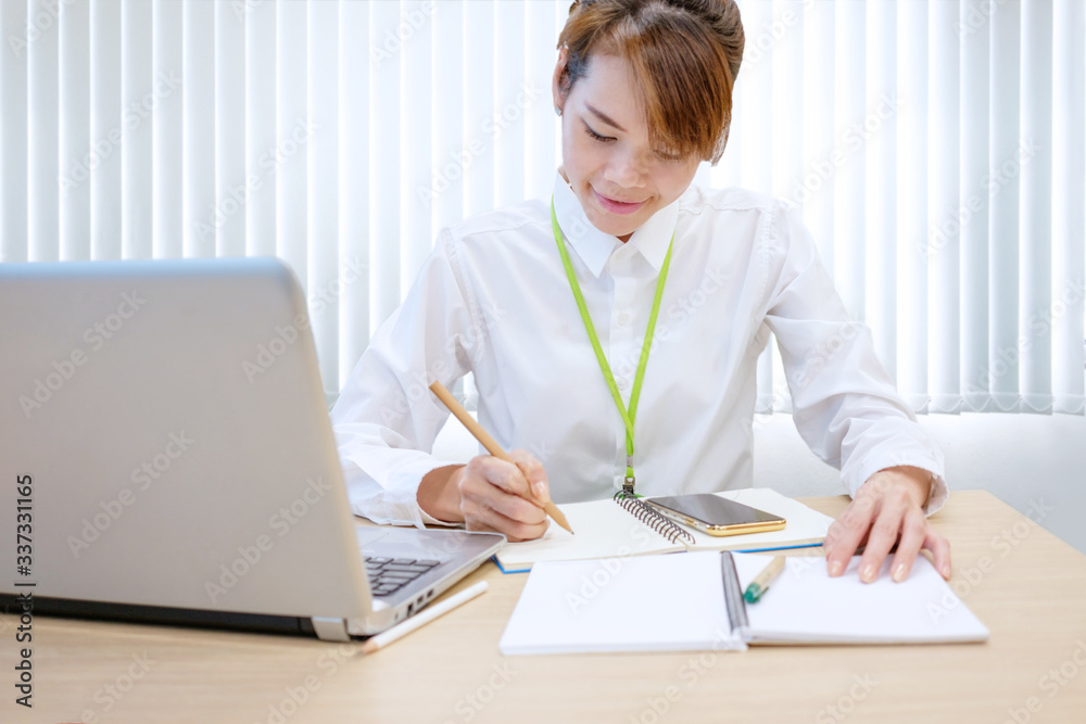Modern young asian business woman working with laptop at workplace Modern young asian business woman working with laptop at workplace