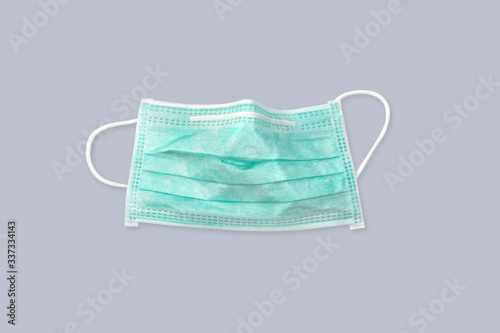 antiviral medical mask for protection against coronavirus. prevention of the spread of virus and pandemic COVID-19.on white background and clipping path for using. top view