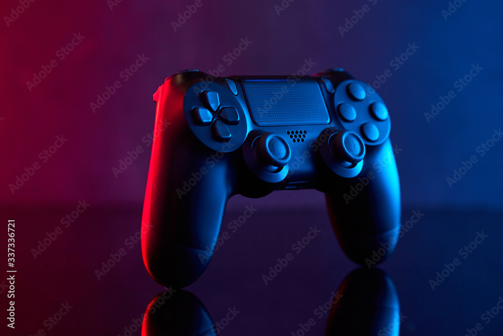 Sony Playstation 4 (PS4) DualShock 4 controller, videogame joystick or gamepad on a table. Close studio shot. Game concept Stock 写真 Adobe Stock