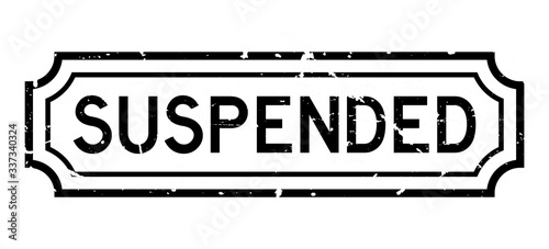 Grunge black suspended word rubber seal stamp on white background