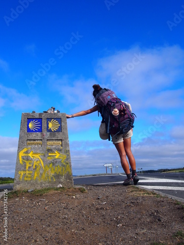 Pilgrim and Camino waymark at the Finisterre and Muxia, Camino de Santiago, Way of St. James, Journey from Santa Marina to Dumbria, Fisterra-Muxia way, Spain