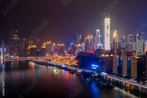 Aerial view of Hong Ya dong Cave, Historic Chinese folk religion town with skyscraper with Chongqing in Chinese © Davidzfr