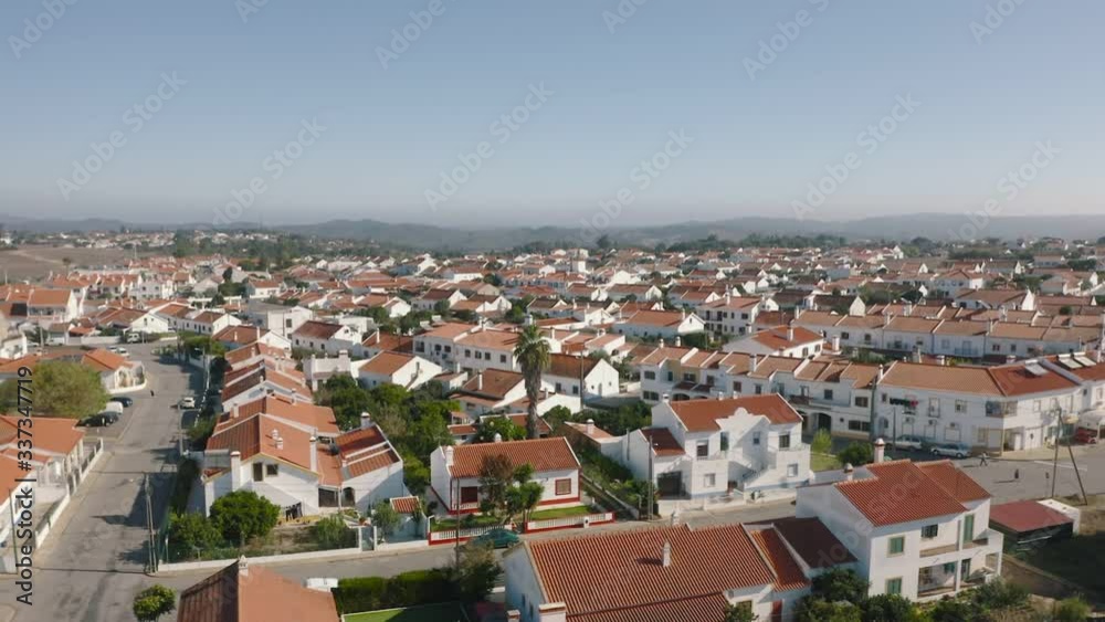 Typical portuguese village viewed from above with aerial drone footage flying over the town. Aerial View Red Tiled Roofs Typical Village, Portugal Typical portuguese village viewed from above with aerial drone footage flying over the town. Aerial View Red Tiled Roofs Typical Village, Portugal