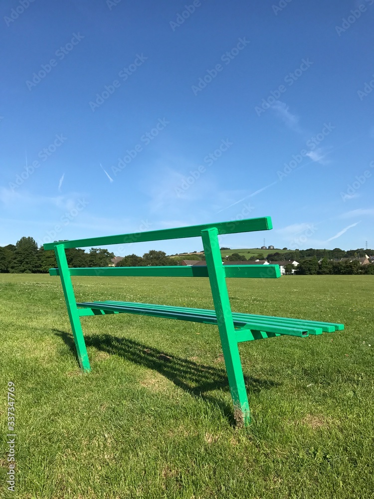 Wooden bench in a public park. Space for copy Wooden bench in a public park. Space for copy