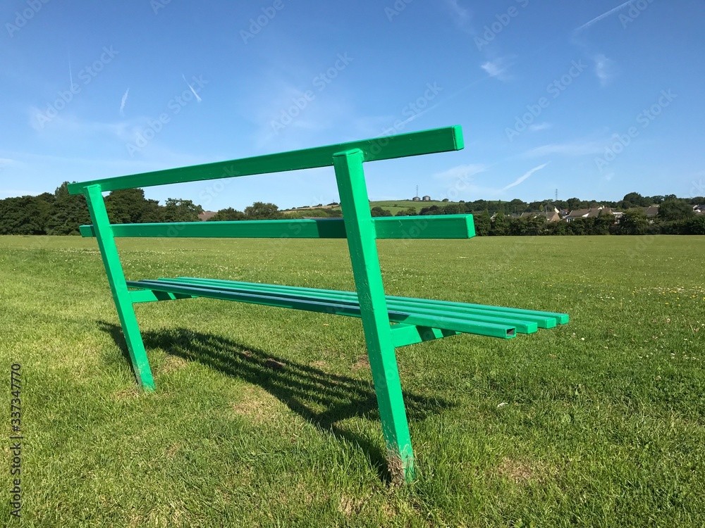 Wooden bench in a public park. Space for copy Wooden bench in a public park. Space for copy