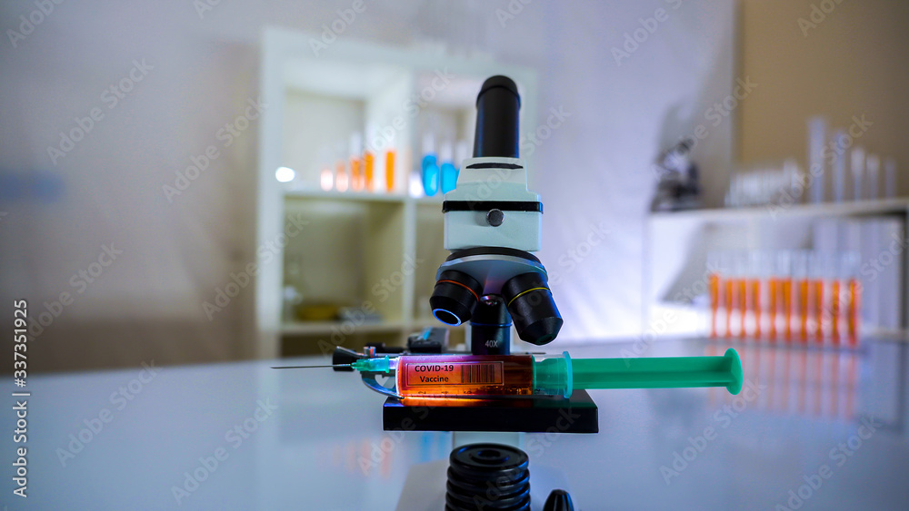 The small microscope and the coronavirus syringe vaccine The small microscope and the coronavirus syringe vaccine