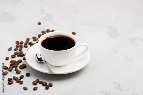 cup of black coffee on a light background