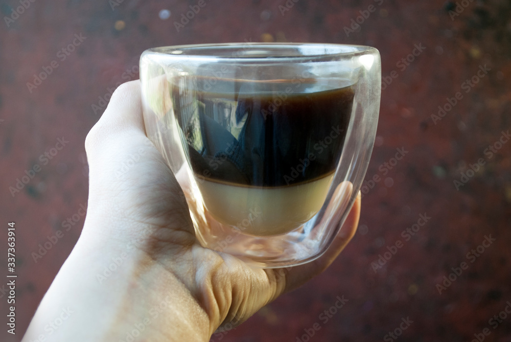 Vietnamese coffee with condensed milk in glass cups. Glass cup in the