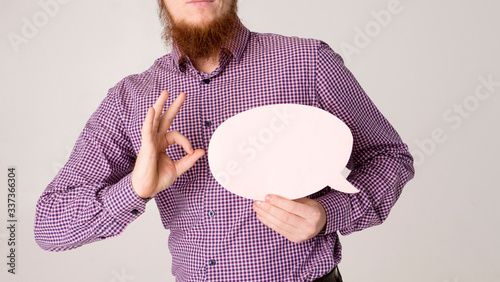 blue speech bubble in man hand