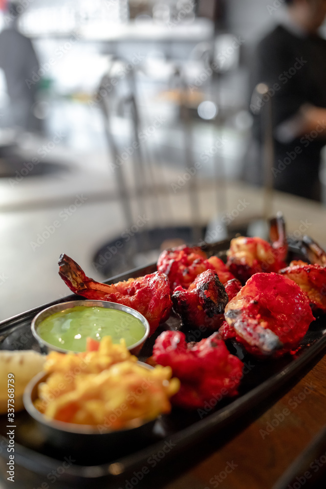 tandoori shrimp baked in the oven, traditional Indian dish tandoori shrimp baked in the oven, traditional Indian dish