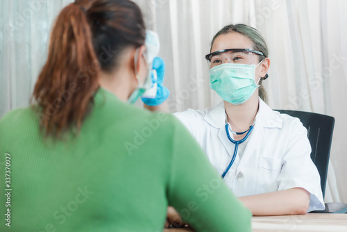 Doctor and senior woman wearing facemasks during coronavirus and flu outbreak. Virus and illness protection, home quarantine. COVID-2019