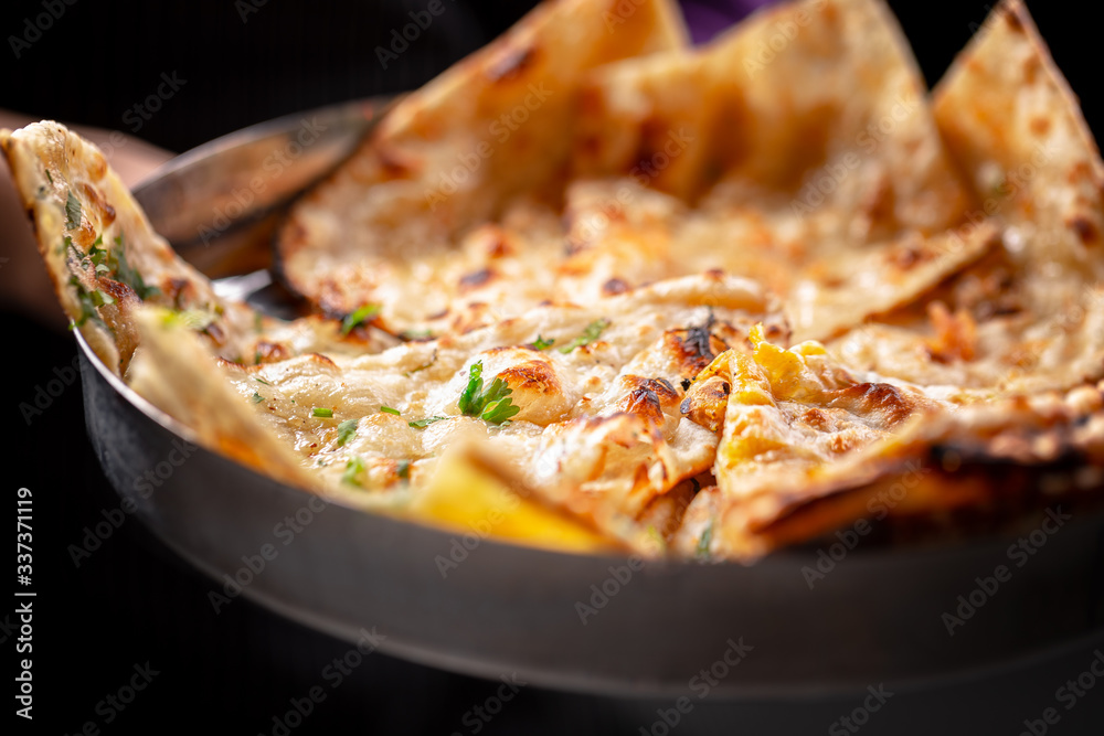 naan bread, a traditional Indian delicacy naan bread, a traditional Indian delicacy