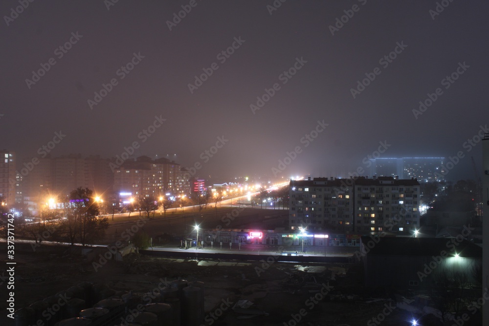 night view of the city city in the fog 