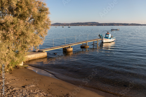 Boat in a small pier in Adamas village photo