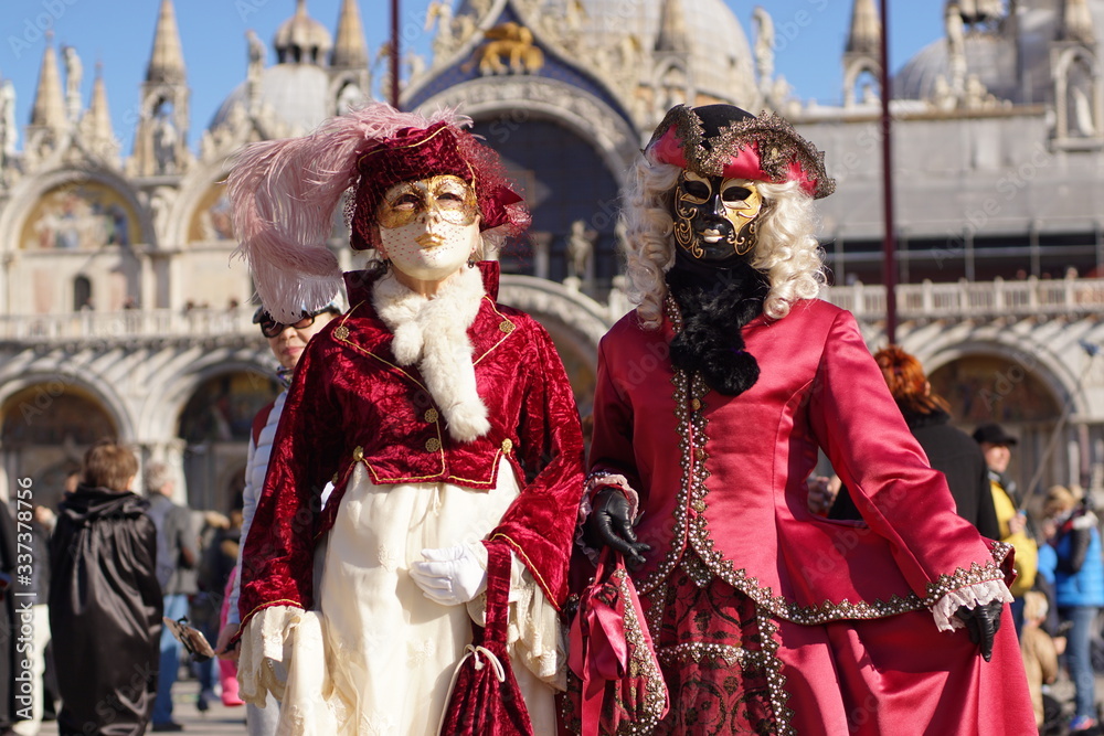 VENICE / ITALY - February 6 2016: Carnival performers participate this event in Piazza San Marco in Venice, Italy. The tradition began in 1162 to celebrate the defeated Ulrico, Patriarch of Aquileia