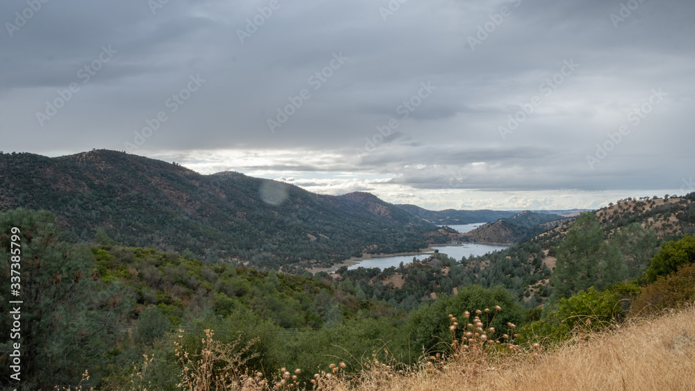 view on a fjord in north california, with a forest and cloudy sky view on a fjord in north california, with a forest and cloudy sky