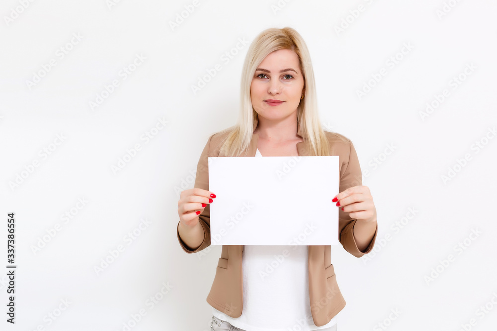 Your text here. Pretty young excited woman holding empty blank board. Studio portrait on white background. Mock up for design Your text here. Pretty young excited woman holding empty blank board. Studio portrait on white background. Mock up for design
