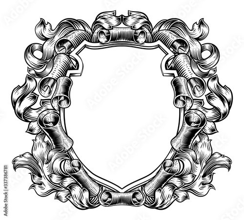 A coat of arms crest scroll and leaves vintage medieval style family heraldic shield decorative background frame. photo