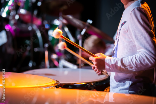 Young drummer in orchestra - B&W