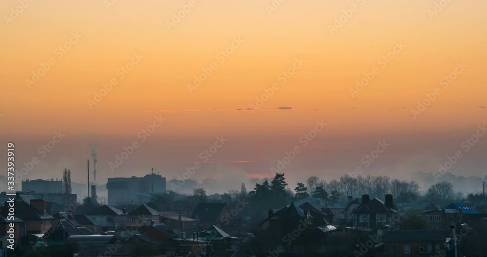 Rising sun against the background of buildings and streets in the interval shooting Rising sun against the background of buildings and streets in the interval shooting