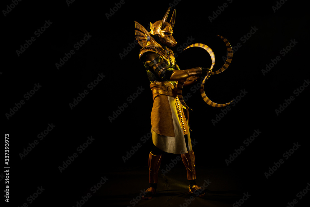 Φωτογραφία a male actor in a suit of an Egyptian mythology character, the golden deity Jack