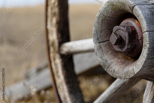 Obraz na plátně close up of a wooden spoked wheel