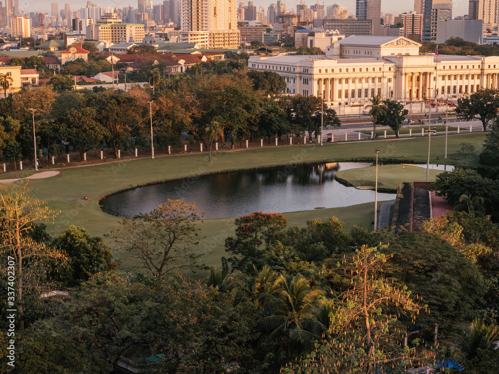 Intramuros Golf Club with the Skyline of Manila in the background