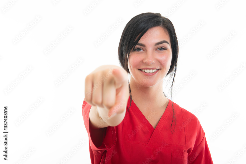 Portrait of young attractive female nurse pointing camera Portrait of young attractive female nurse pointing camera