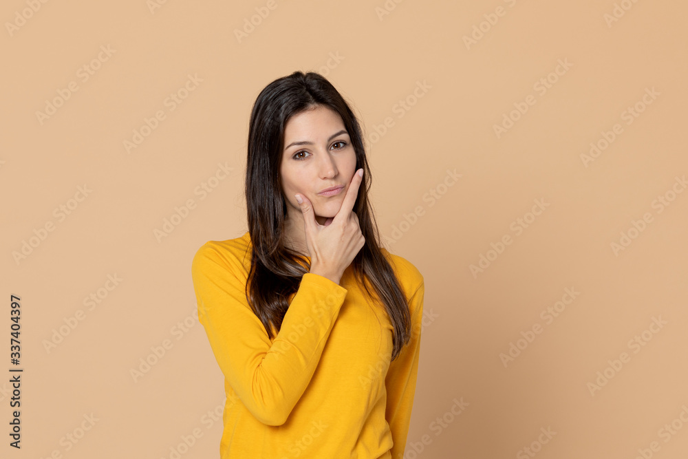 Brunette young woman wearing a yellow T-shirt Brunette young woman wearing a yellow T-shirt