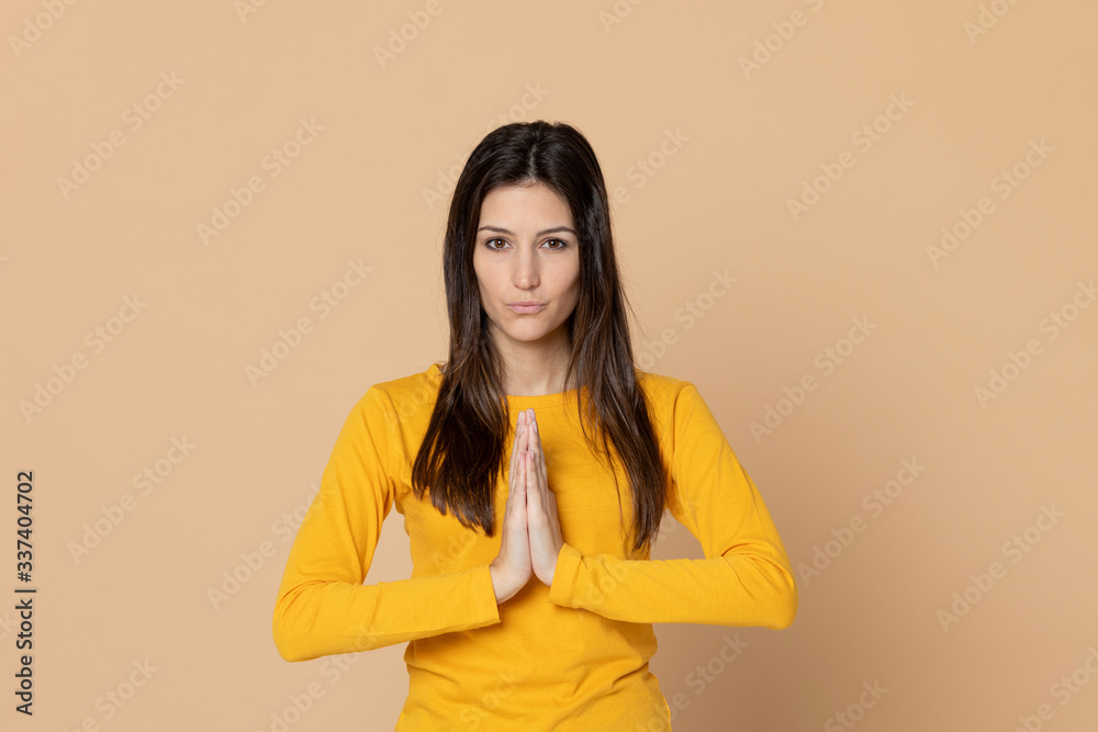 Brunette young woman wearing a yellow T-shirt Brunette young woman wearing a yellow T-shirt