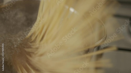 Cooking spaghetti pasta in a full boiling water pot