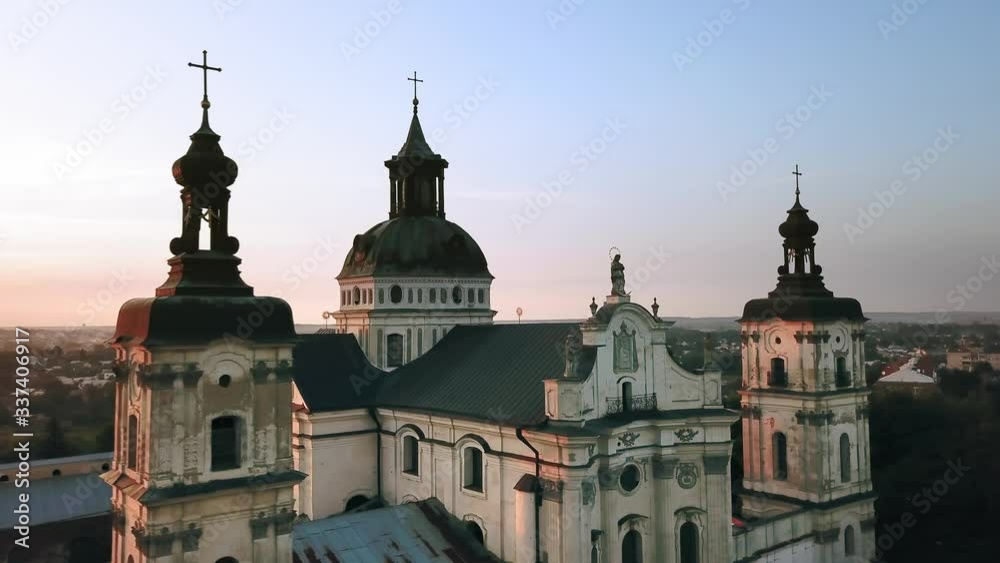 Aerial view of Monastery of the Barefoot Carmelites at sunset, Medieval Catholic ancient fortress in Berdichiv city, Ukraine. Monastery of the Barefoot Carmelites, Aerial survey of Monastery of the Ba Aerial view of Monastery of the Barefoot Carmelites at sunset, Medieval Catholic ancient fortress in Berdichiv city, Ukraine. Monastery of the Barefoot Carmelites, Aerial survey of Monastery of the Ba