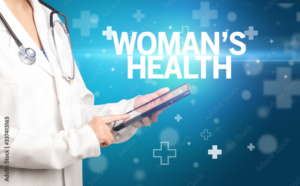 doctor writes notes on the clipboard with WOMAN’S HEALTH inscription, first aid concept doctor writes notes on the clipboard with WOMAN’S HEALTH inscription, first aid concept