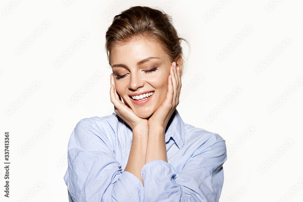 Happy woman with fresh clean skin and charming smile in blue shirt . Happy woman with fresh clean skin and charming smile in blue shirt .