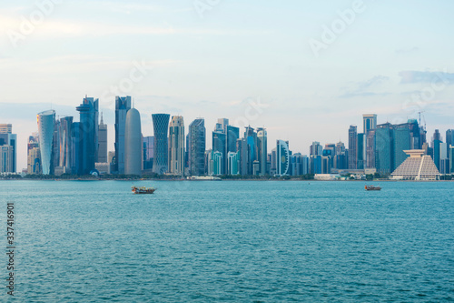 View of modern skyscrapers and bay at twilight in Doha  Qatar