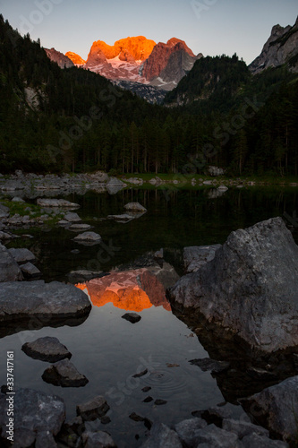 The Dachstein with a reflection at the Gosausee during sunset