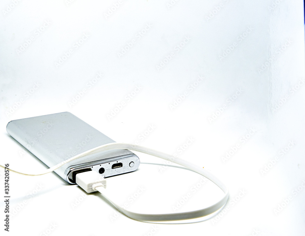 power bank with usb line connect on isolated white background with copy space power bank with usb line connect on isolated white background with copy space
