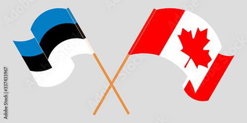 Crossed and waving flags of Estonia and Canada
