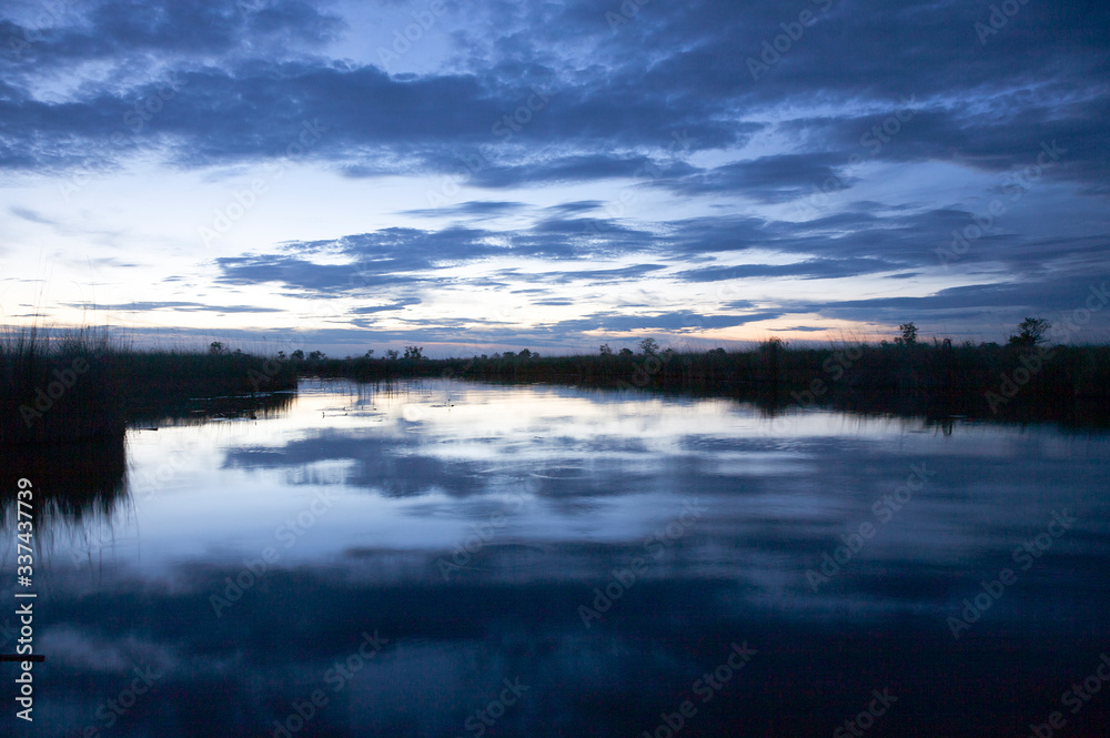 Obraz premium Okavango delta in botswana and sunset - Moremi Reserve