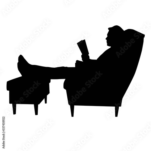 man sitting in armchair with legs on footstool and reeding book black vector silhouette isolated on white background