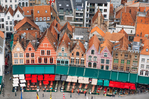 beautiful Typical houses in Grote Markt, Bruges on a cloudy day.