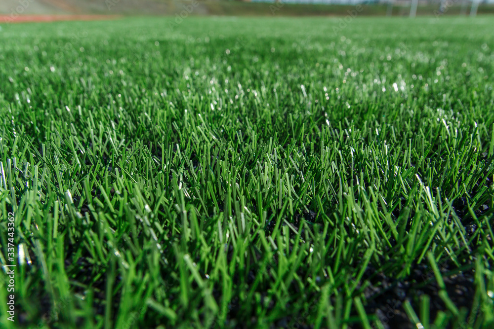 green artificial turf on the football field green artificial turf on the football field