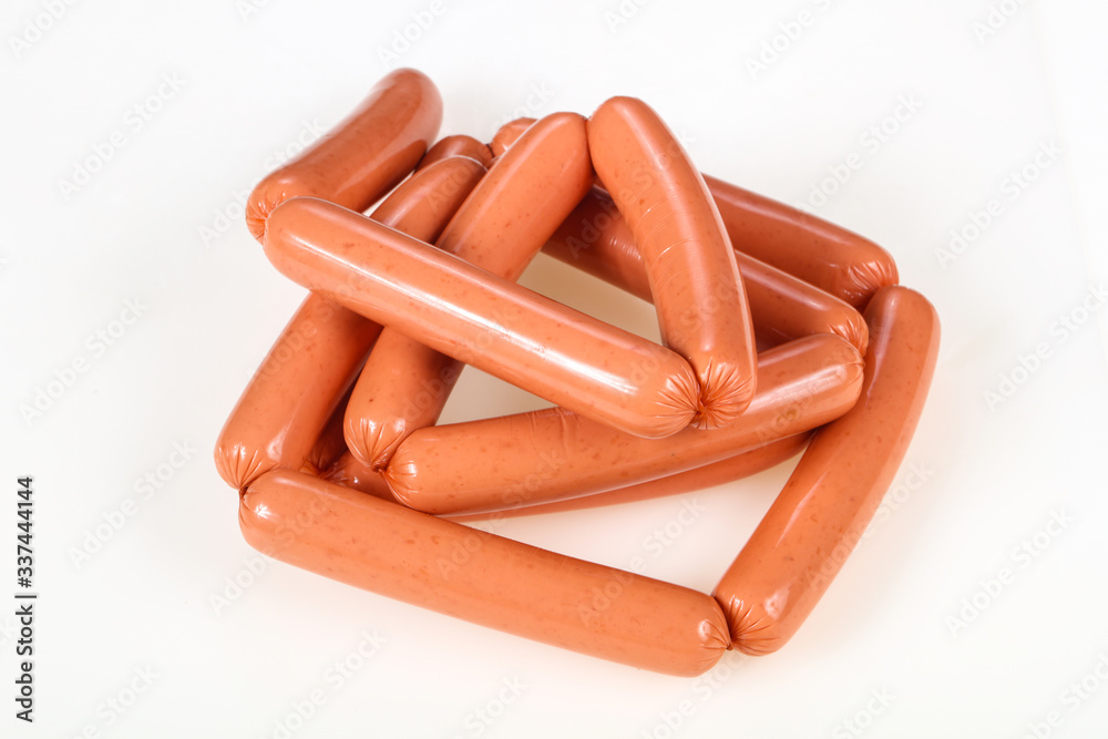 Tasty meat sausages over white background