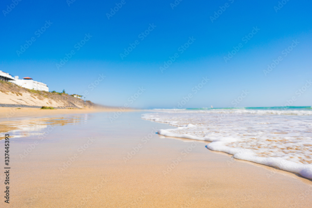 Sandy beach and calm sea in the Canary Islands