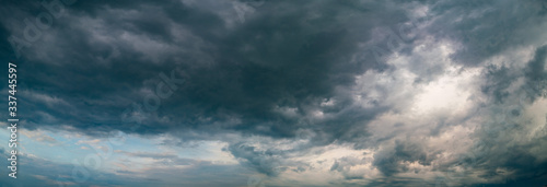 Panorama of storm clouds on sky over city