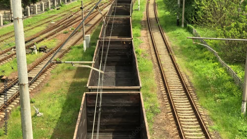 Railway tracks with old rusty empty wagons, top view. Old train service on a Sunny summer day. Railway tracks with old rusty empty wagons, top view. Old train service on a Sunny summer day.