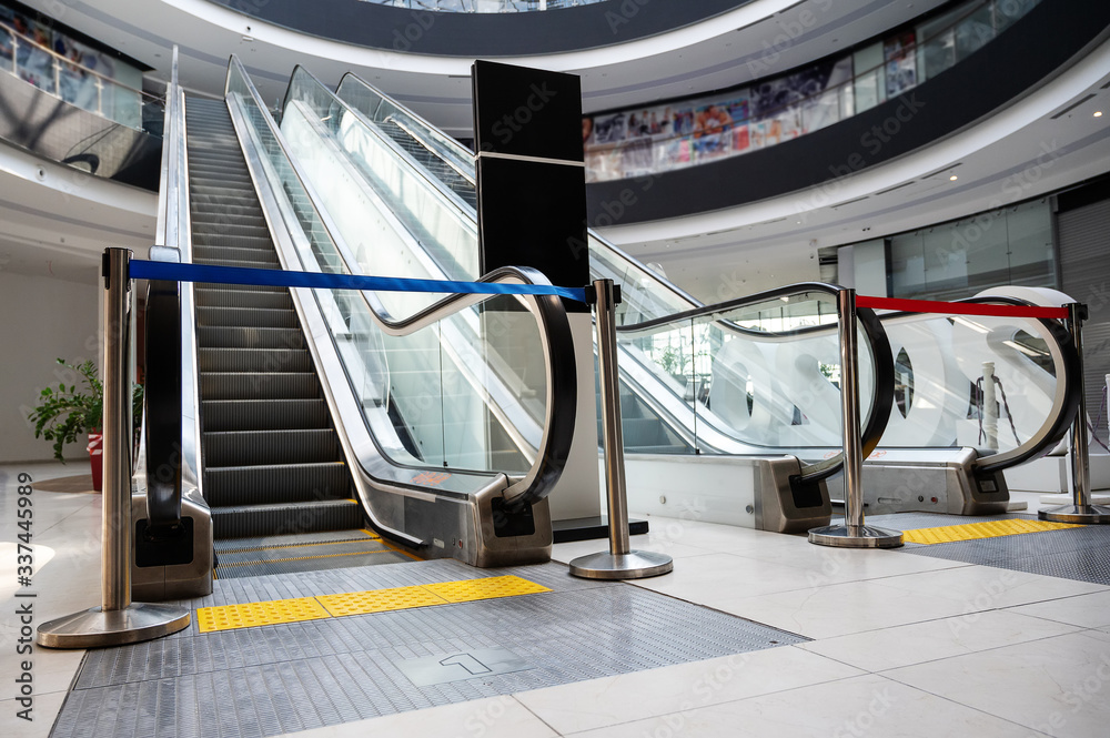 closed passage to escalators in the shopping center