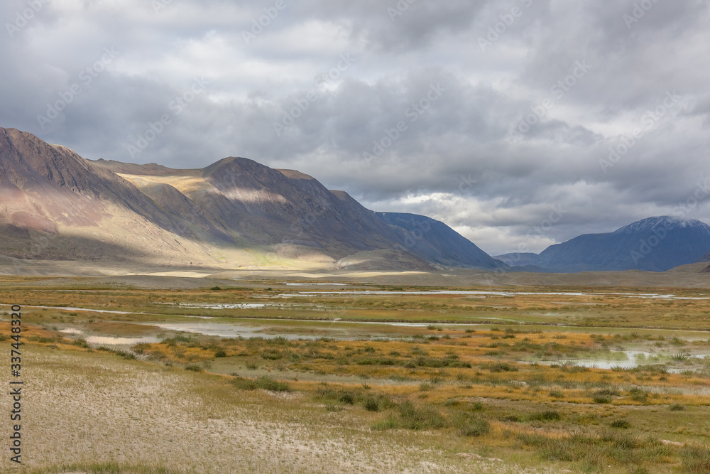 Landscape of valley in rolling hills of Western Mongolian steppe