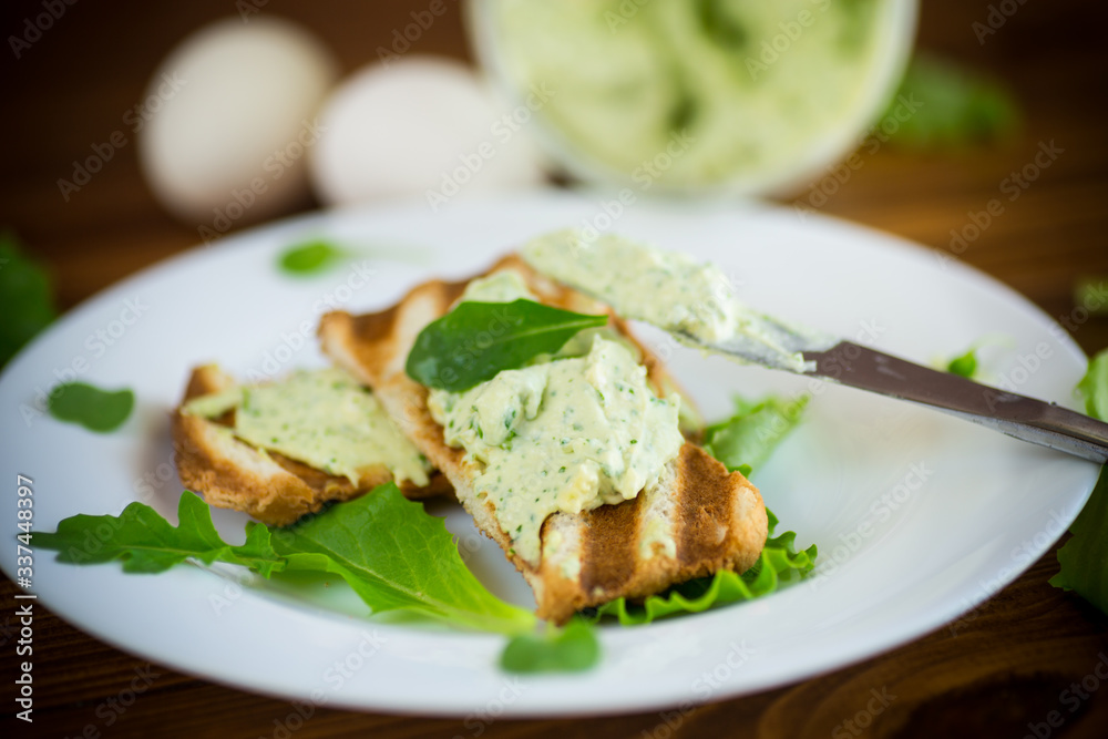 green bread spread of arugula, curds and eggs with fried toast green bread spread of arugula, curds and eggs with fried toast