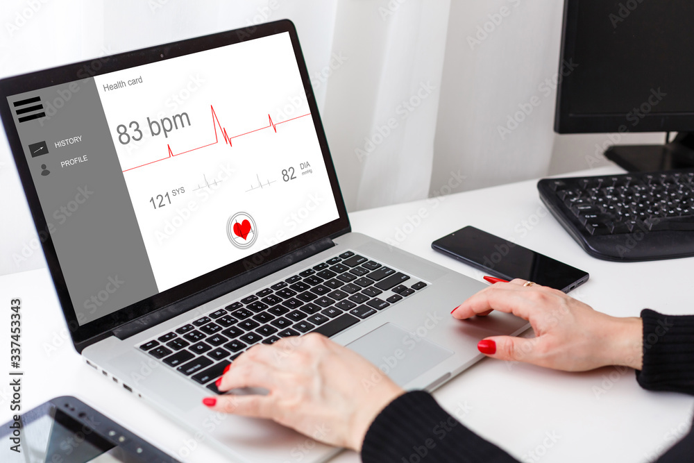 Woman Using Laptop - diagnosis and treatment on a laptop online Woman Using Laptop - diagnosis and treatment on a laptop online